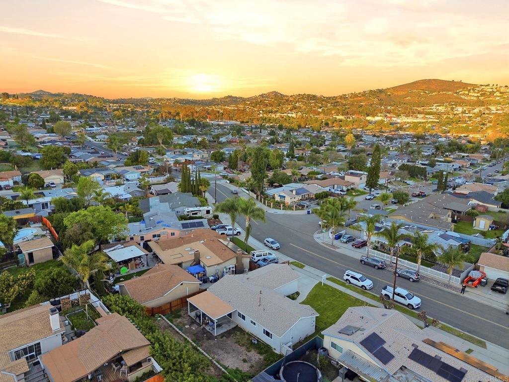 738 Carlsbad Street Spring Valley, CA 91977 - Photo 11 of 40 an aerial view of a city with lots of residential buildings and mountain view in back