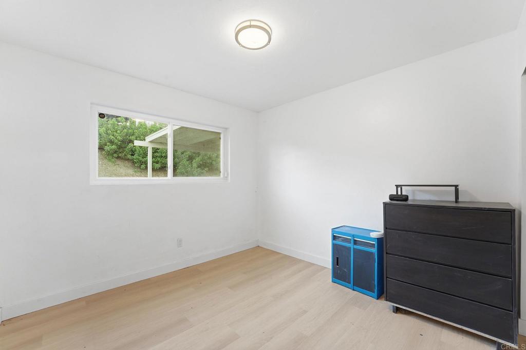 738 Carlsbad Street Spring Valley, CA 91977 - Photo 25 of 40 a room with a dresser and a window