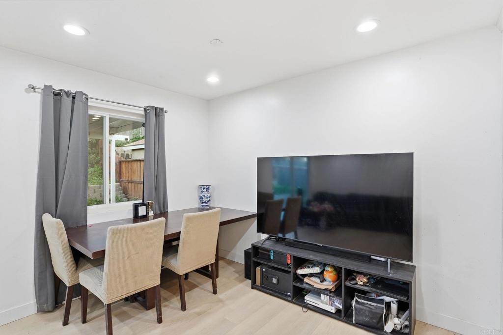 738 Carlsbad Street Spring Valley, CA 91977 - Photo 32 of 40 a living room with furniture and a flat screen tv