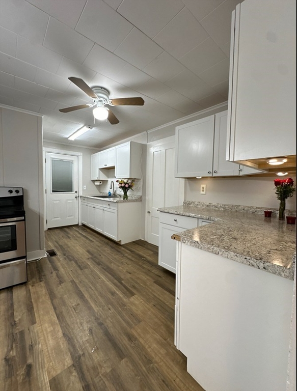26 Green Street Monson, MA 01057 - Photo 11 of 38 a kitchen with granite countertop a stove top oven a sink dishwasher and a refrigerator