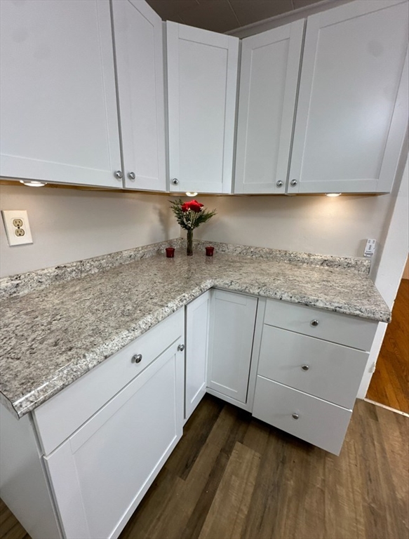 26 Green Street Monson, MA 01057 - Photo 13 of 38 a kitchen with granite countertop white cabinets and sink