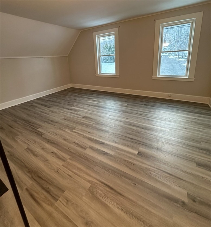 26 Green Street Monson, MA 01057 - Photo 23 of 38 an empty room with wooden floor and windows
