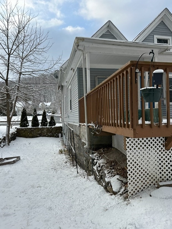 26 Green Street Monson, MA 01057 - Photo 35 of 38 a view of a brick house with a large window and wooden fence