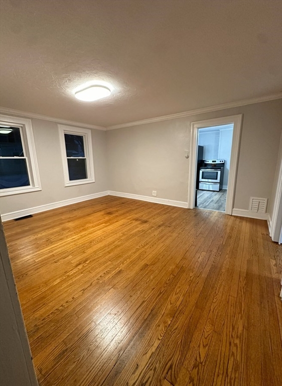 26 Green Street Monson, MA 01057 - Photo 9 of 38 a view of an empty room with wooden floor and a window