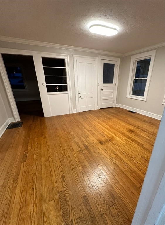 26 Green Street Monson, MA 01057 - Photo 10 of 38 a view of a livingroom with wooden floor and stairs