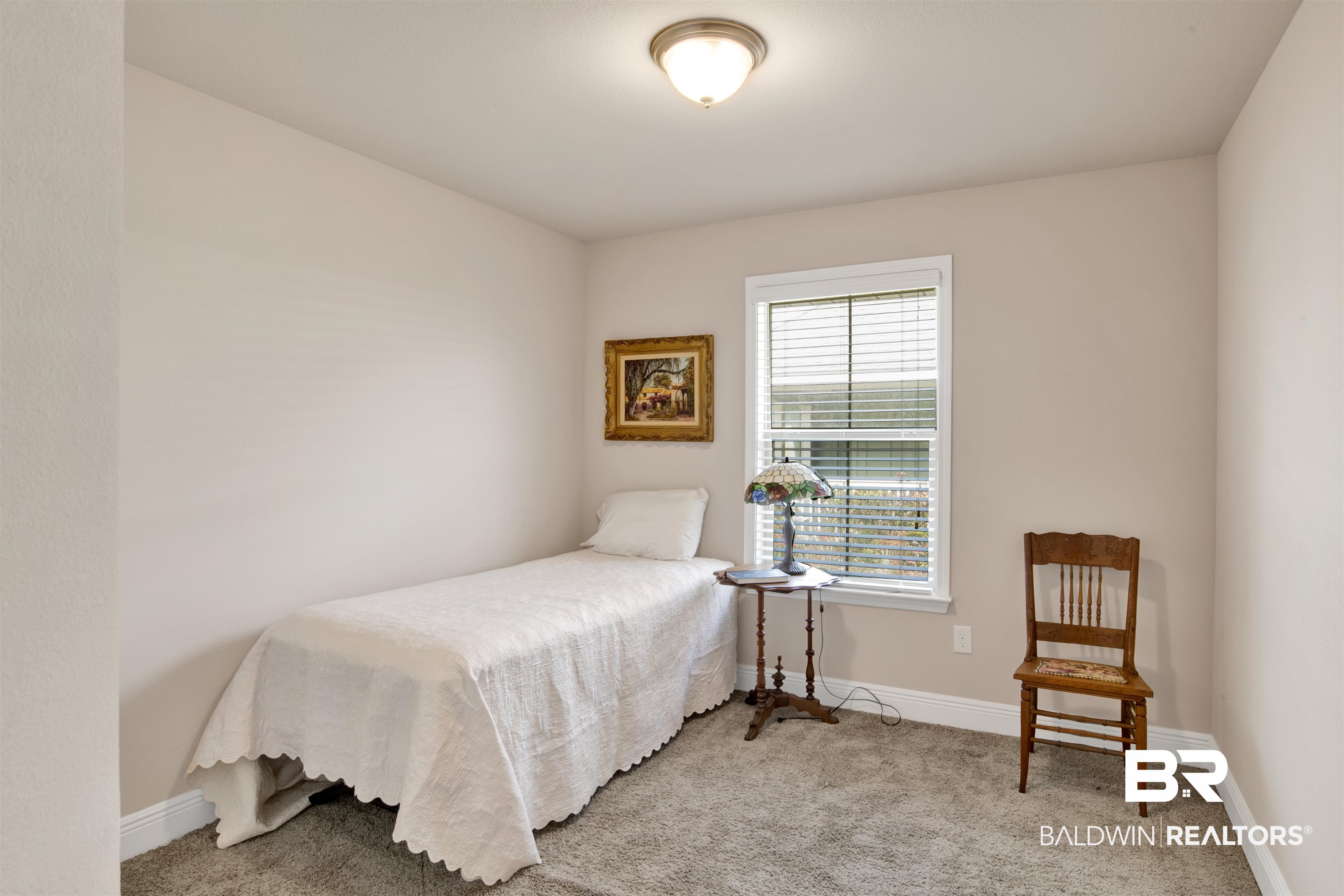 22056 Garland Loop Silverhill, AL 36576 - Photo 18 of 28 Bedroom featuring light colored carpet and baseboards