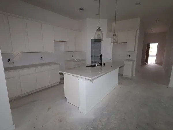 an aerial view of a swimming pool with a yard