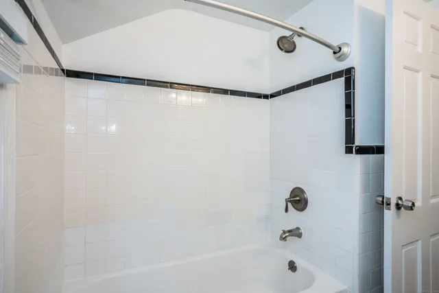 a bathroom with a shower and a bathtub