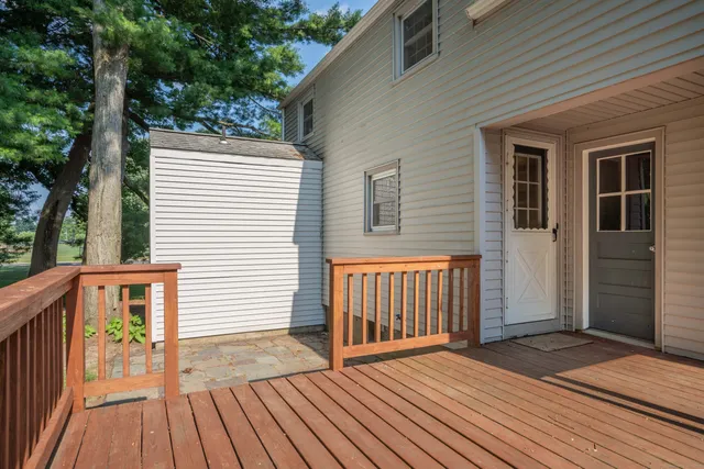 a view of backyard with a deck