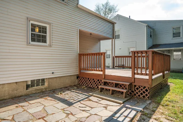 a view of a patio with a bench