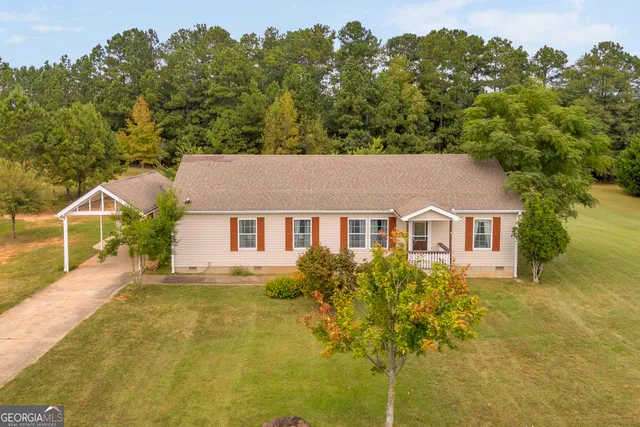 a house with trees in the background