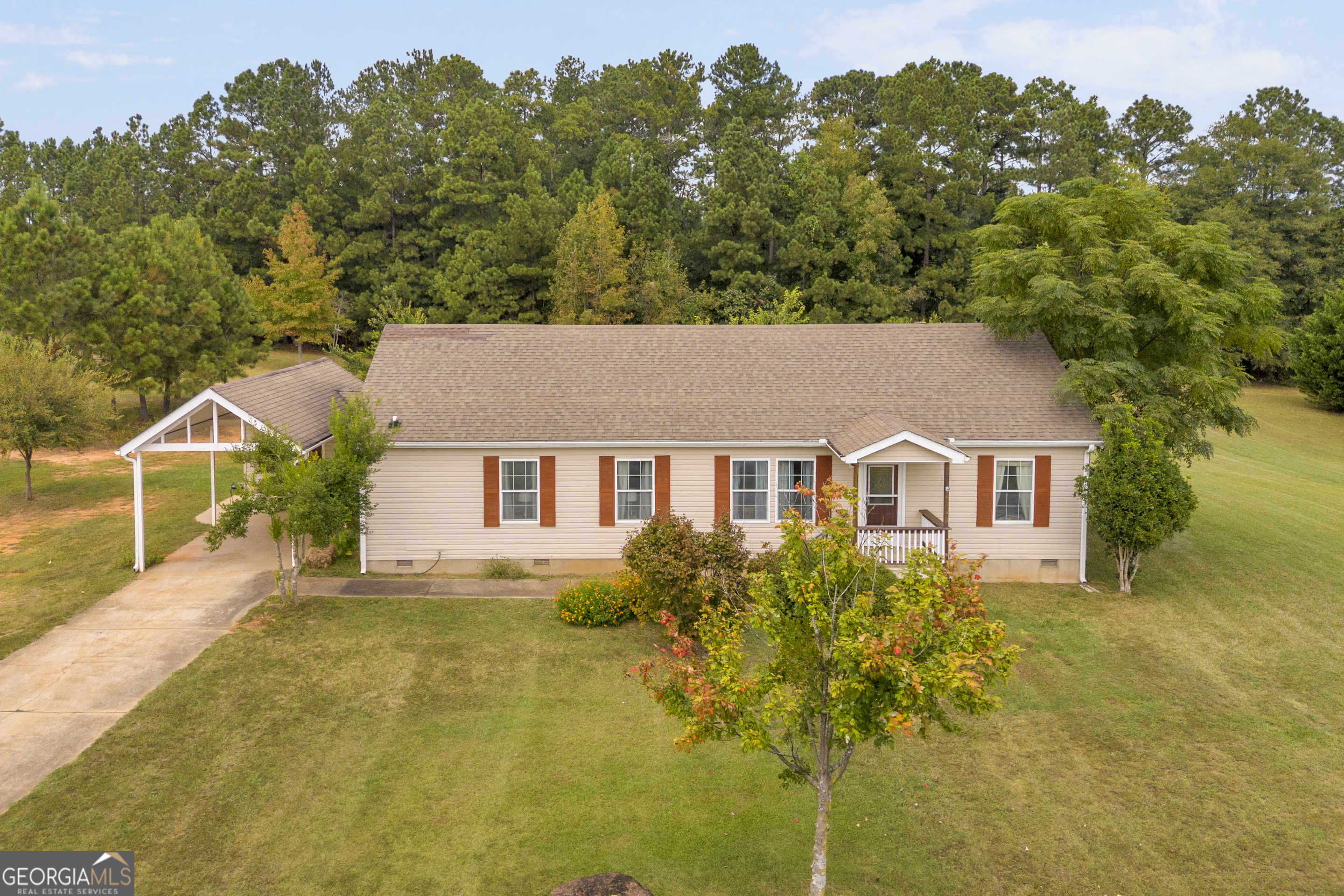 a house with trees in the background