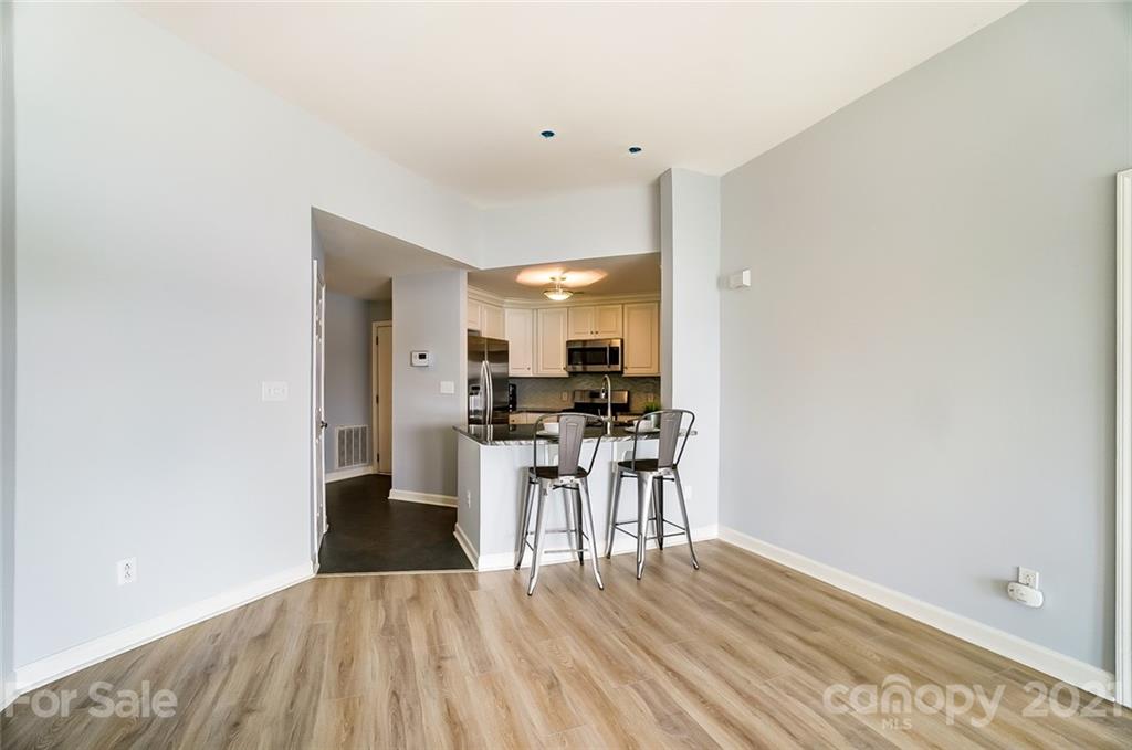 1342 Torrence Circle Davidson, NC 28036 - Photo 14 of 39 a view of a kitchen with dining table and chairs