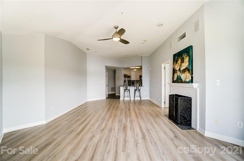 1342 Torrence Circle Davidson, NC 28036 - Photo 16 of 39 a view of a livingroom with furniture wooden floor window and a fireplace
