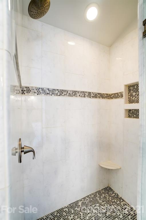 1342 Torrence Circle Davidson, NC 28036 - Photo 22 of 39 a bathroom with a shower and a toilet
