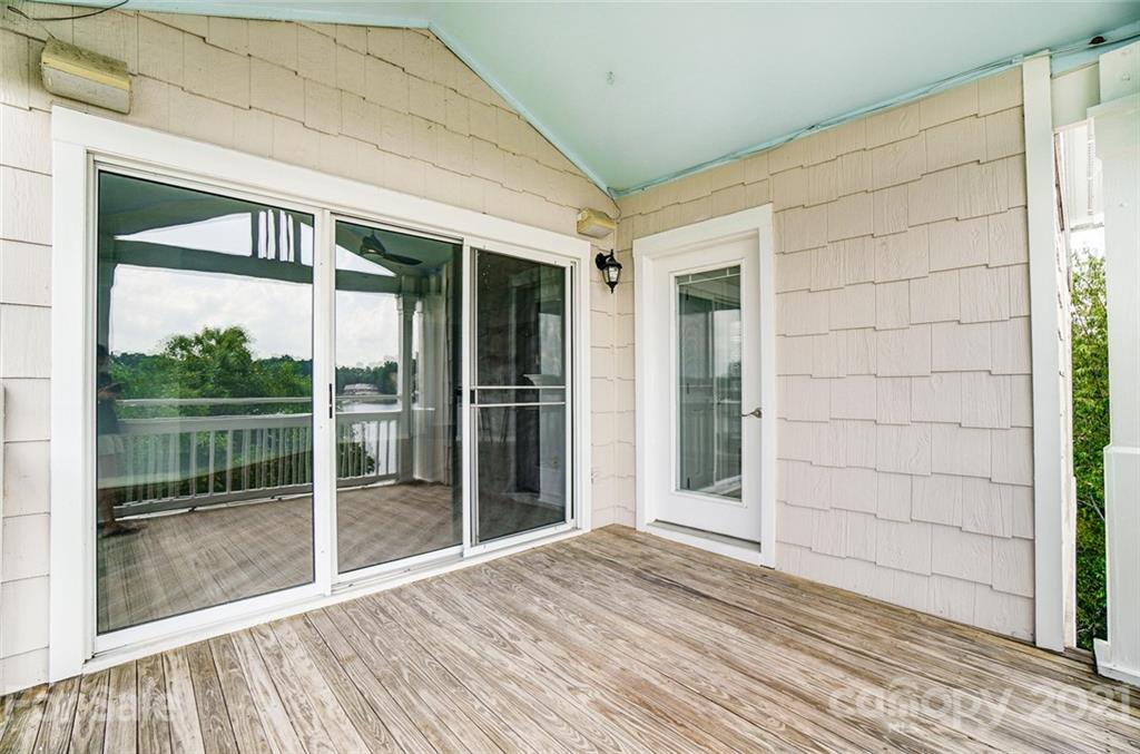 1342 Torrence Circle Davidson, NC 28036 - Photo 31 of 39 a view of a porch with a floor to ceiling window