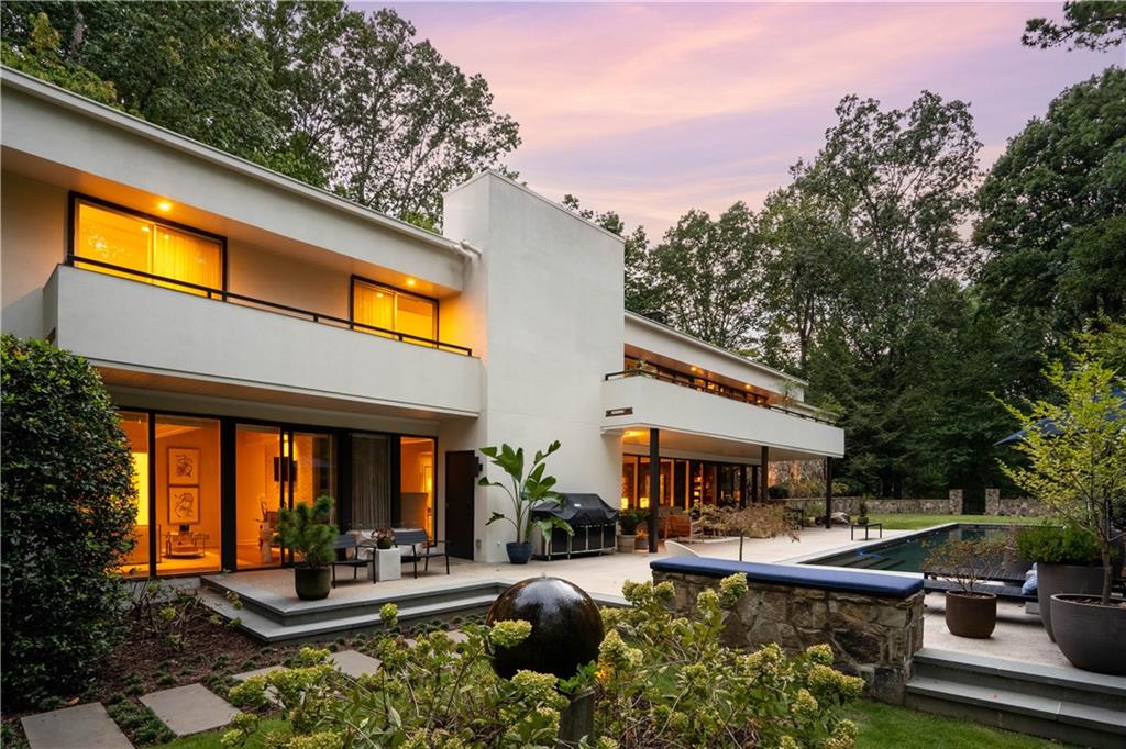 1640 Winterthur Close Northwest Atlanta, GA 30328 - Photo 1 of 57 a front view of house with yard and outdoor seating