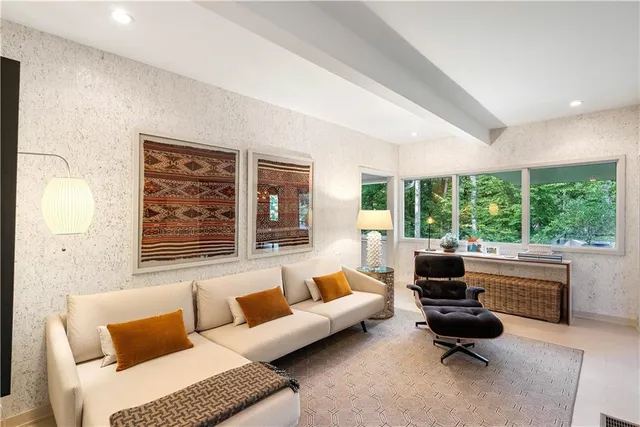 a living room with furniture and a table