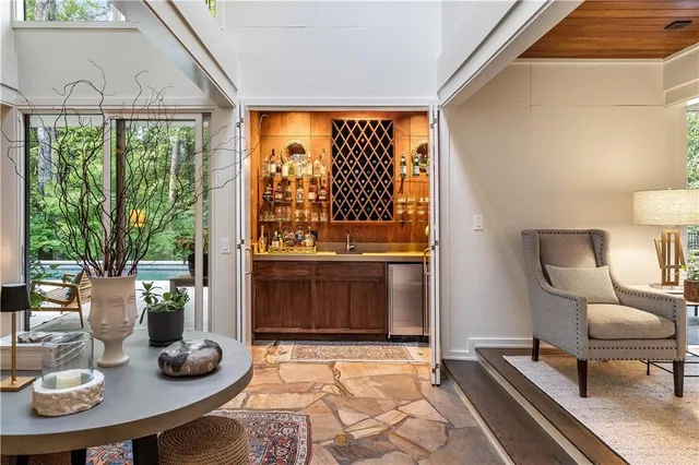 a bathroom with a sink tub vanity and a toilet