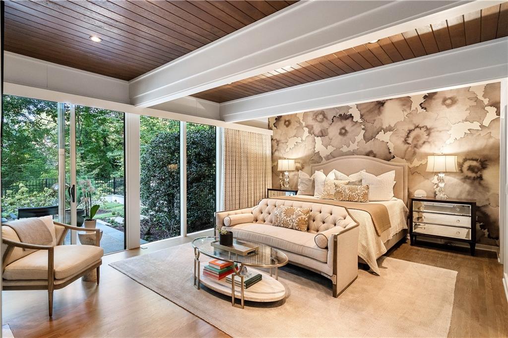 1640 Winterthur Close Northwest Atlanta, GA 30328 - Photo 22 of 57 a bedroom with furniture and a large window