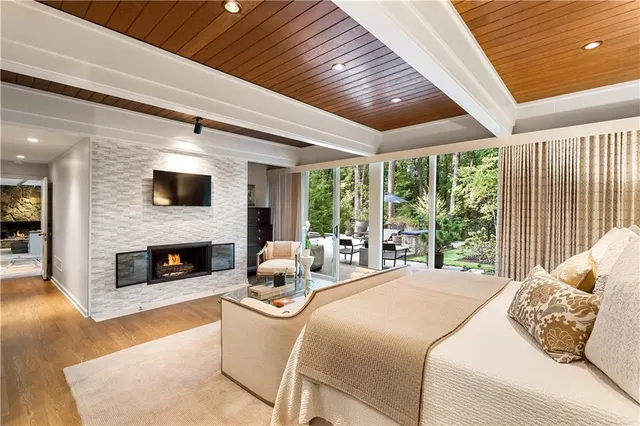 a living room with furniture and large windows