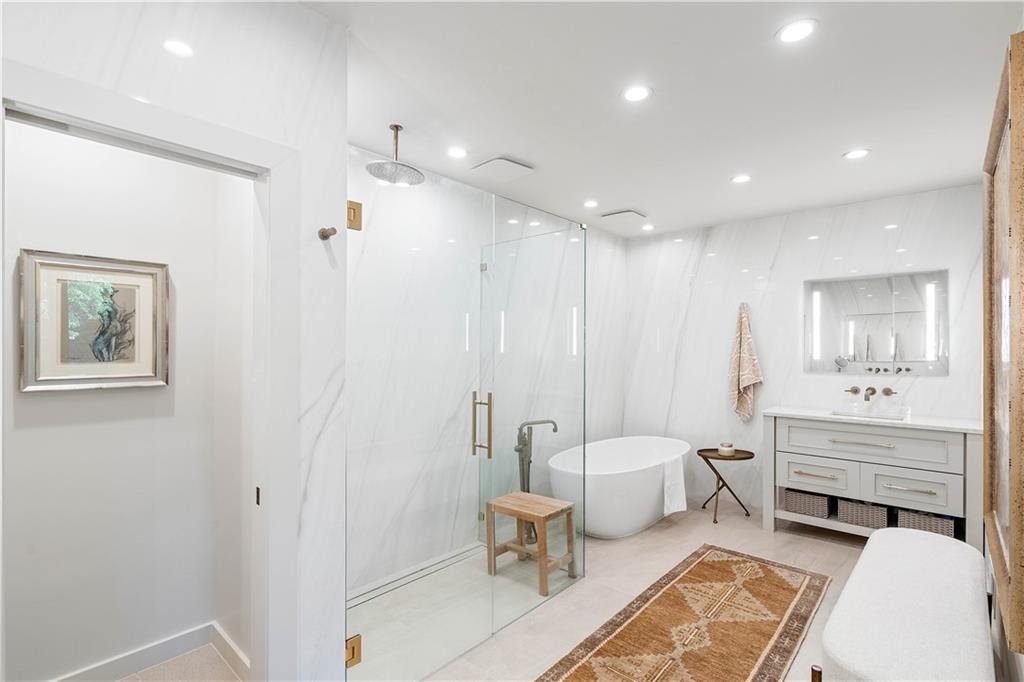 1640 Winterthur Close Northwest Atlanta, GA 30328 - Photo 27 of 57 a bathroom with a double vanity sink toilet and a mirror