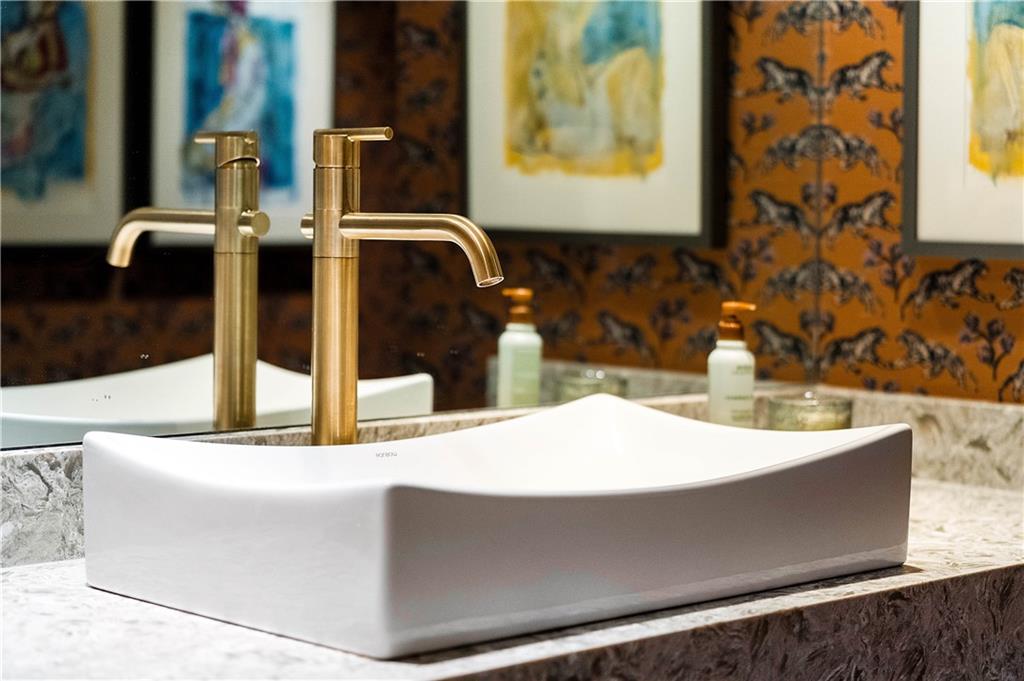 1640 Winterthur Close Northwest Atlanta, GA 30328 - Photo 33 of 57 a bathroom with a sink and a mirror