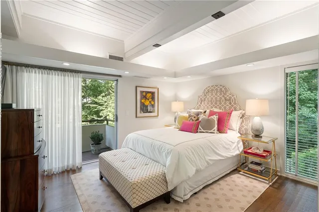 a view of a livingroom with workspace and a window