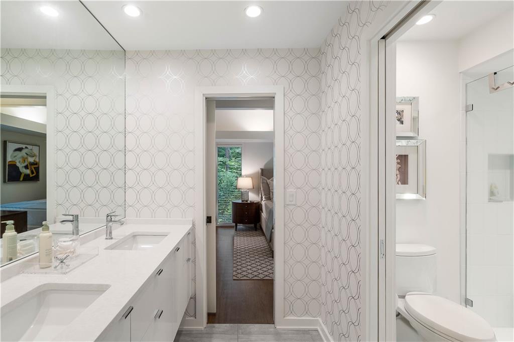 1640 Winterthur Close Northwest Atlanta, GA 30328 - Photo 37 of 57 a en suite bathroom with a sink a toilet and shower