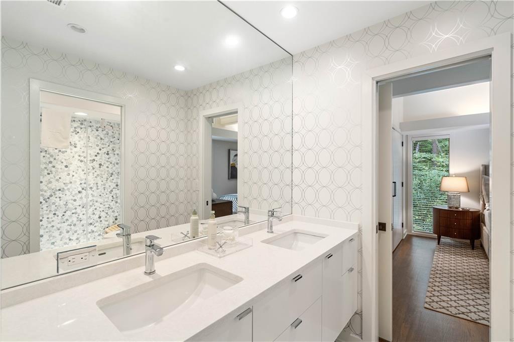 1640 Winterthur Close Northwest Atlanta, GA 30328 - Photo 38 of 57 a en suite bathroom with double sink and a large mirror