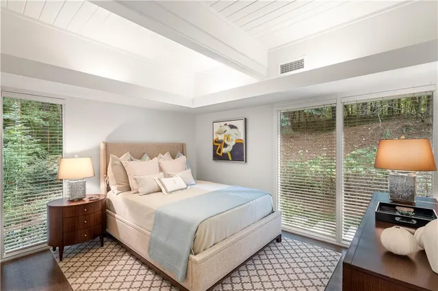 a view of an house with backyard and swimming pool