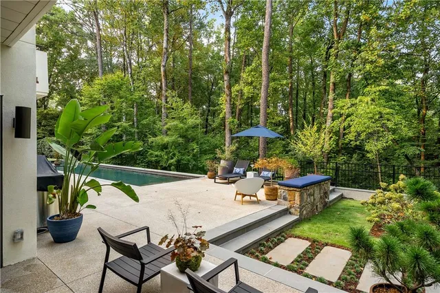 a view of a swimming pool with seating area