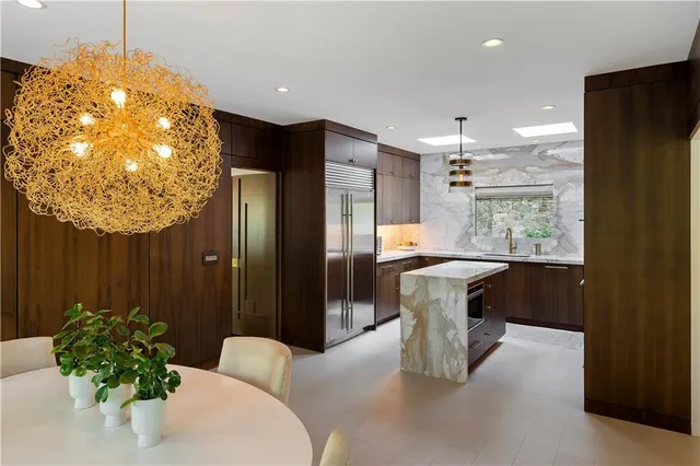 a kitchen with a stove and a kitchen island