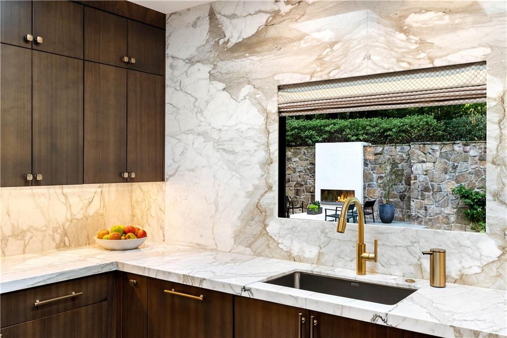 1640 Winterthur Close Northwest Atlanta, GA 30328 - Photo 6 of 57 a kitchen with a sink and a large window