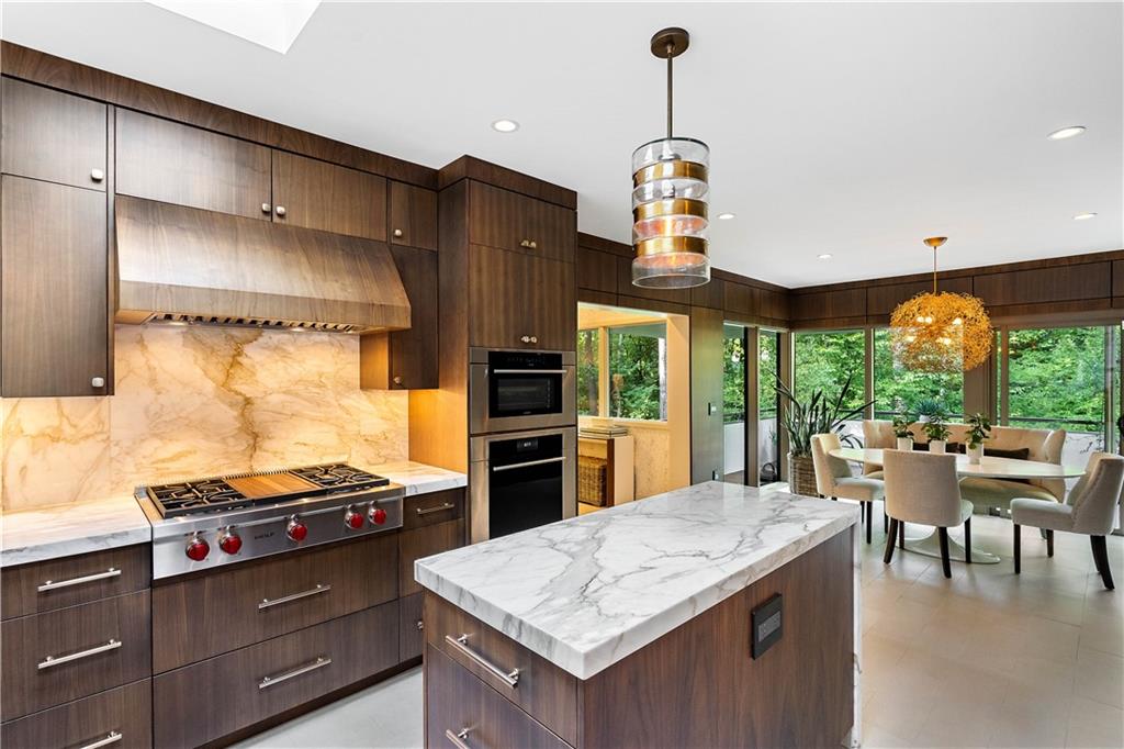 1640 Winterthur Close Northwest Atlanta, GA 30328 - Photo 8 of 57 a kitchen with a stove and a kitchen island