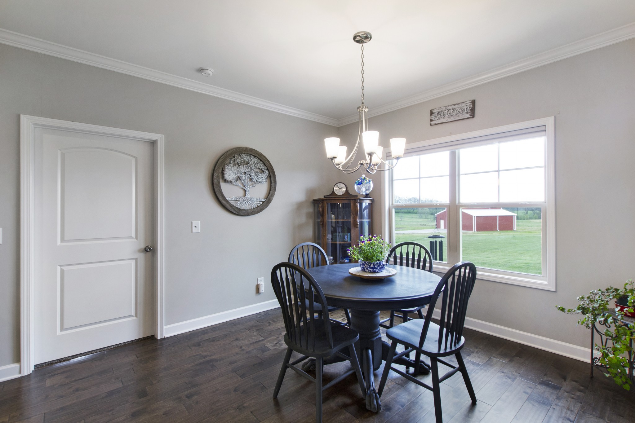 1091 Caballo Trail Gallatin, TN 37066 - Photo 12 of 30 a view of a dining room with furniture a chandelier and wooden floor