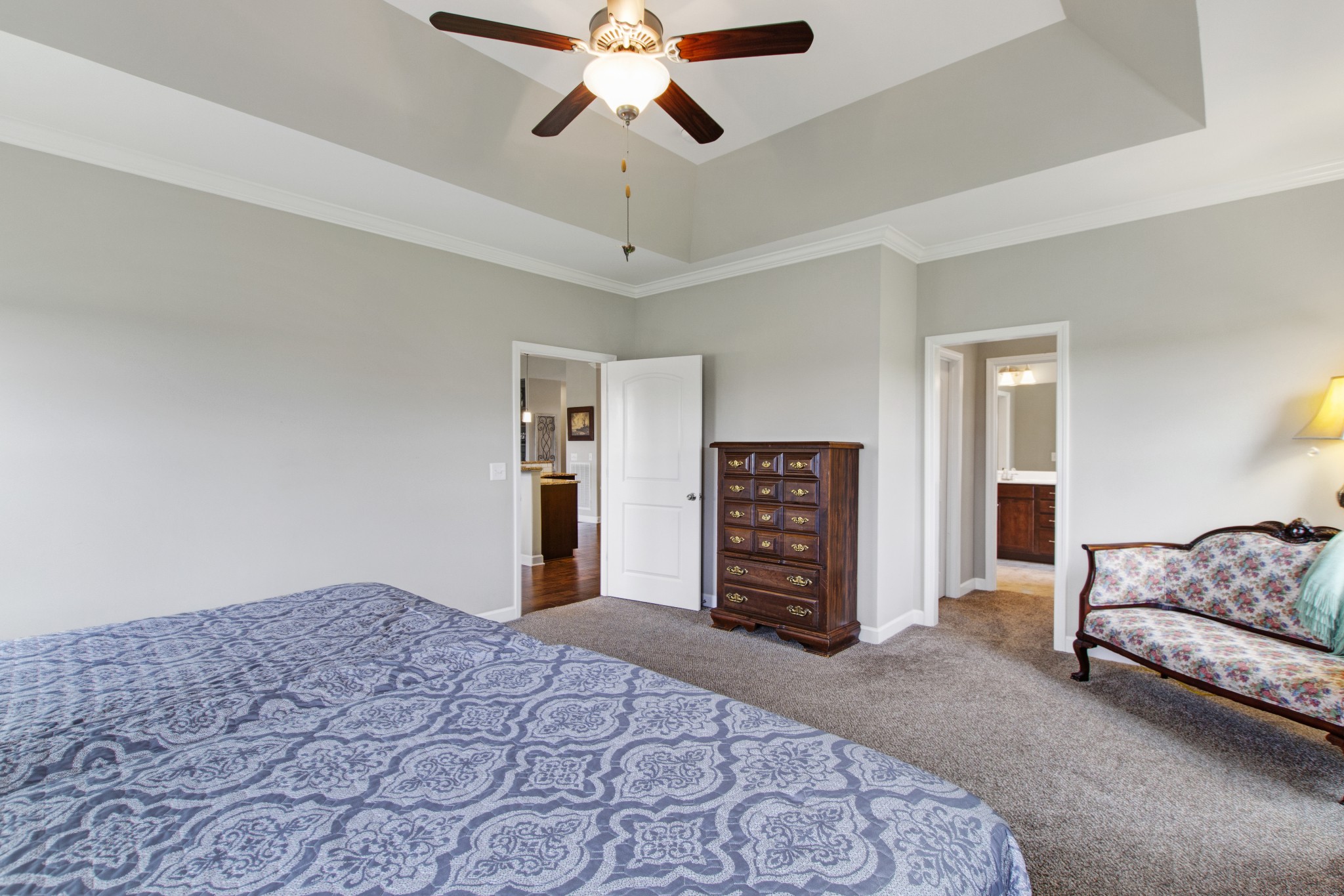 1091 Caballo Trail Gallatin, TN 37066 - Photo 14 of 30 a bedroom with a bed dresser and a chandelier