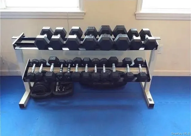 a table with wine bottles and glasses on it