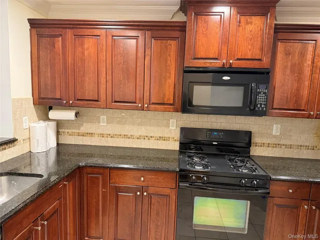 a kitchen with a stove and a sink
