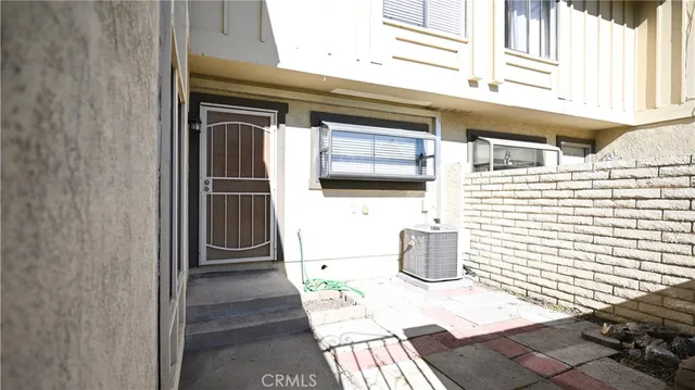 a backyard of a house with barbeque oven