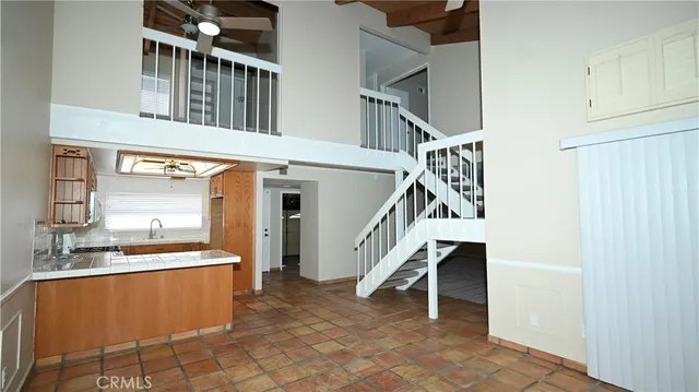a view of an entryway with a kitchen