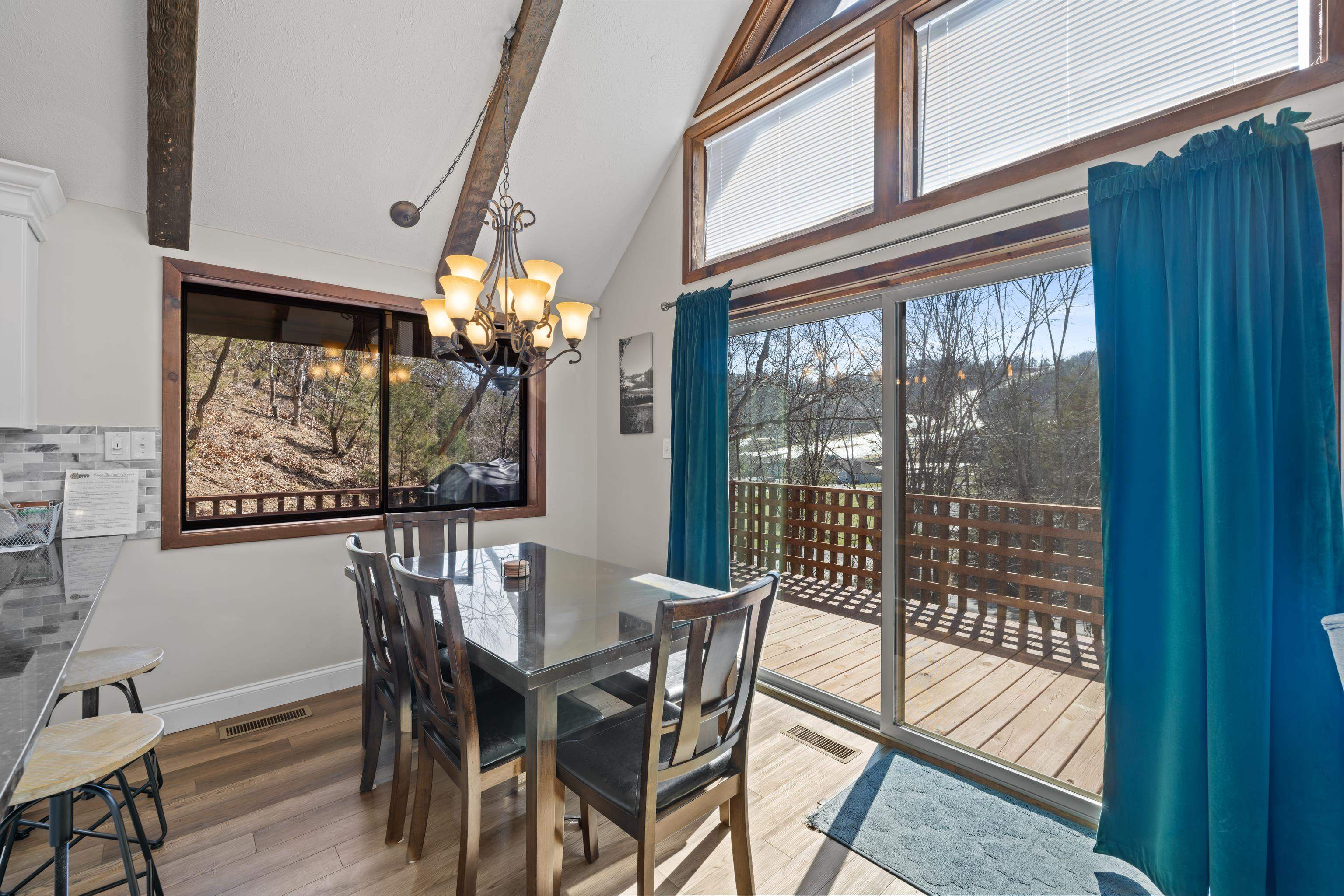 673 Killmon Road Basye, VA 22810 - Photo 18 of 74 a view of a dining room with furniture a chandelier and wooden floor