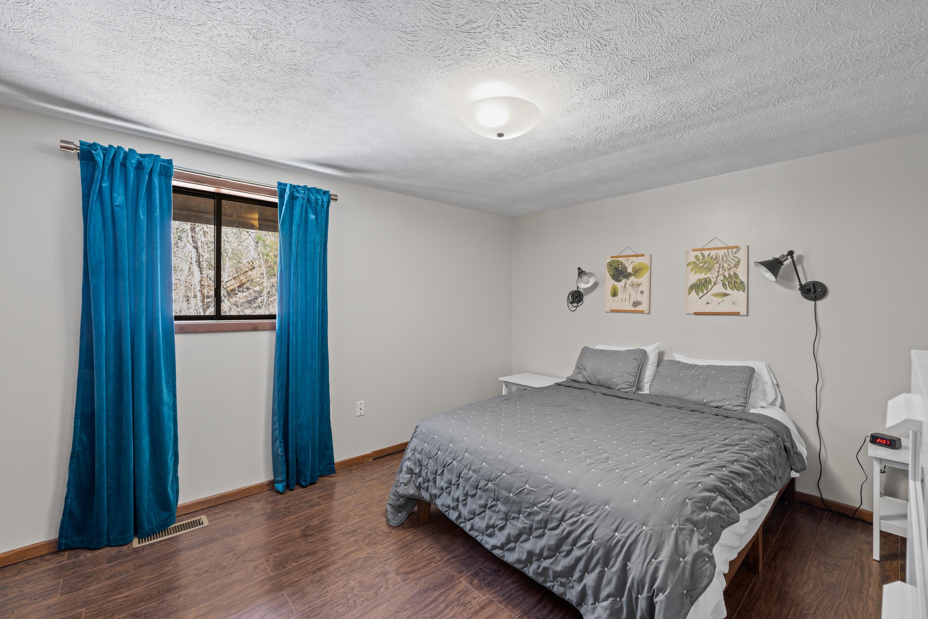 673 Killmon Road Basye, VA 22810 - Photo 19 of 74 a bedroom with a bed and wooden floor
