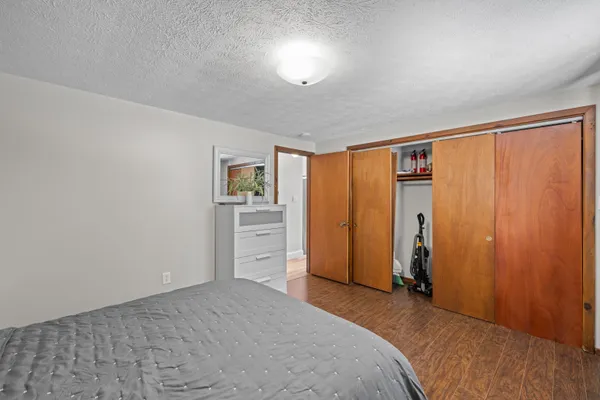 a bedroom with two beds and a chandelier