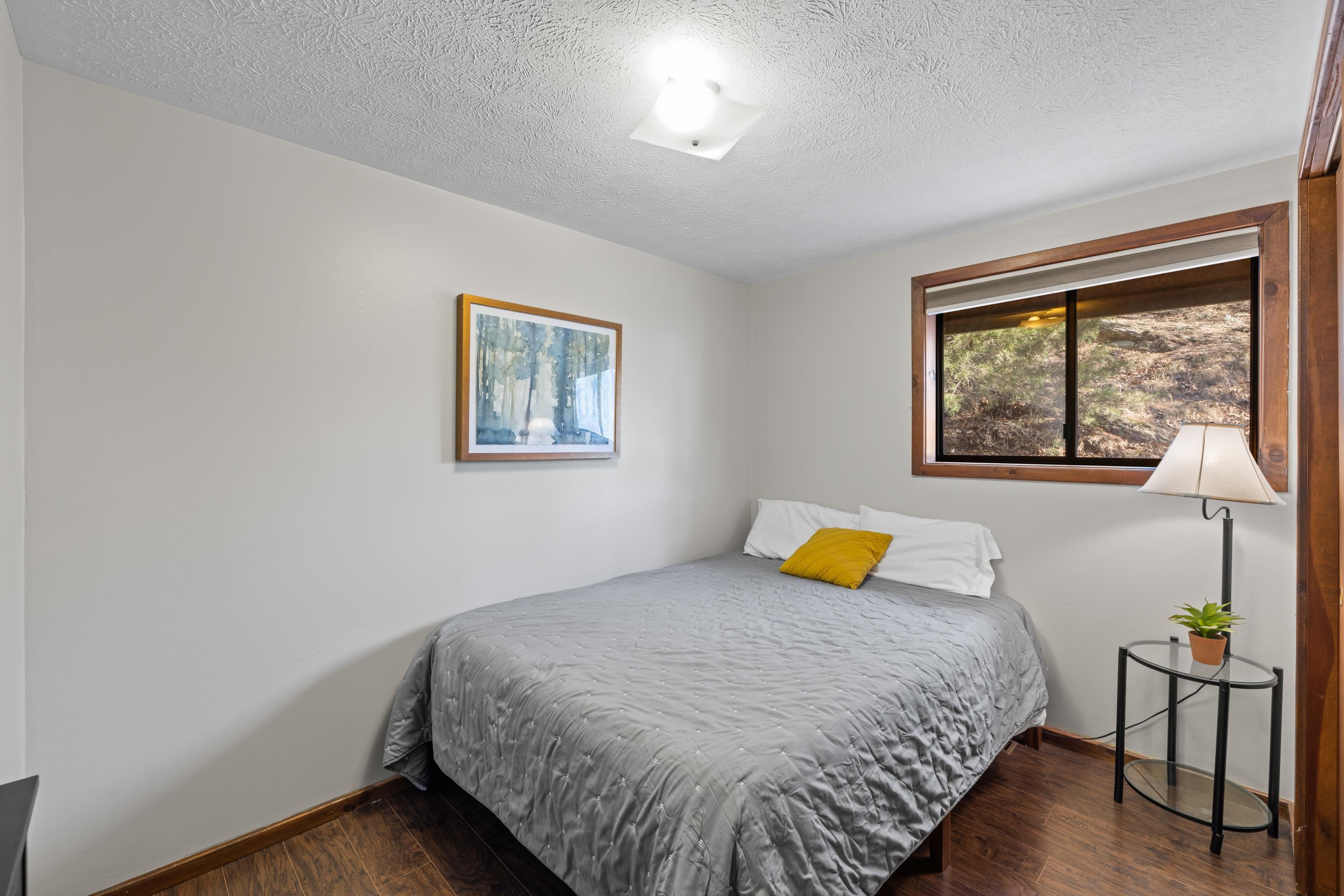 673 Killmon Road Basye, VA 22810 - Photo 26 of 74 a bedroom with a bed and wooden floor