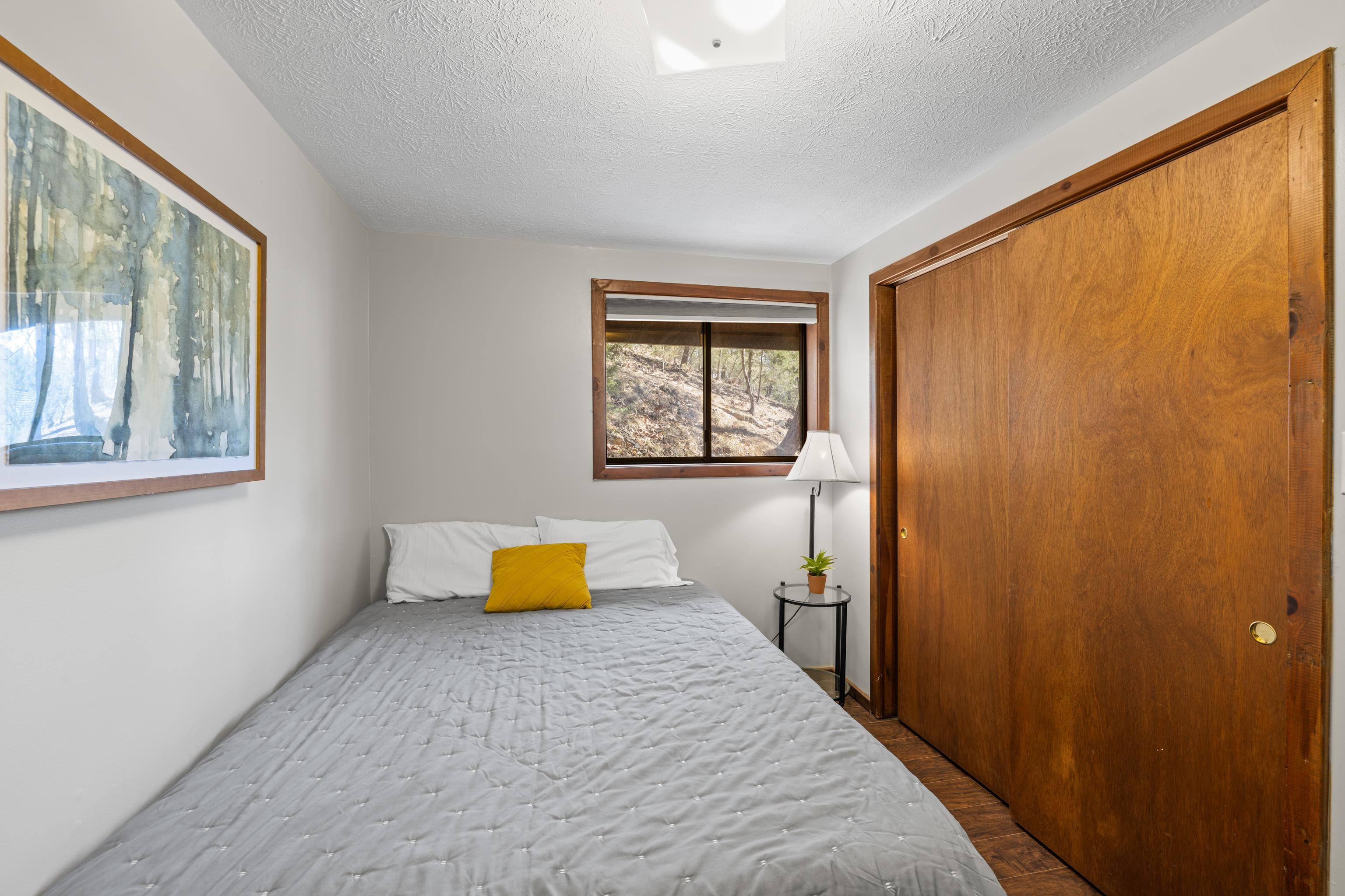 673 Killmon Road Basye, VA 22810 - Photo 27 of 74 a bedroom with a bed and a window