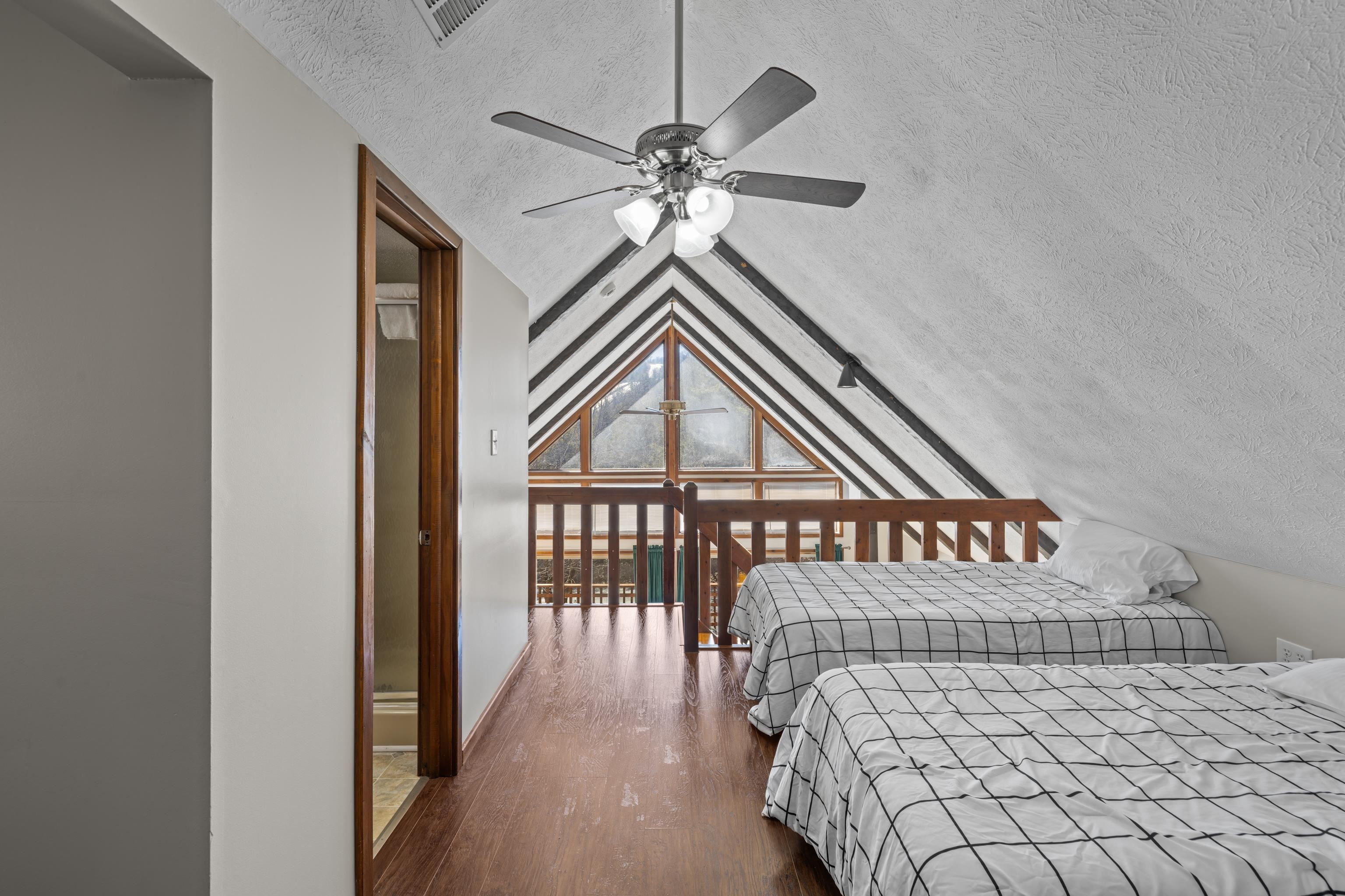 673 Killmon Road Basye, VA 22810 - Photo 29 of 74 a bedroom with a bed and a chandelier