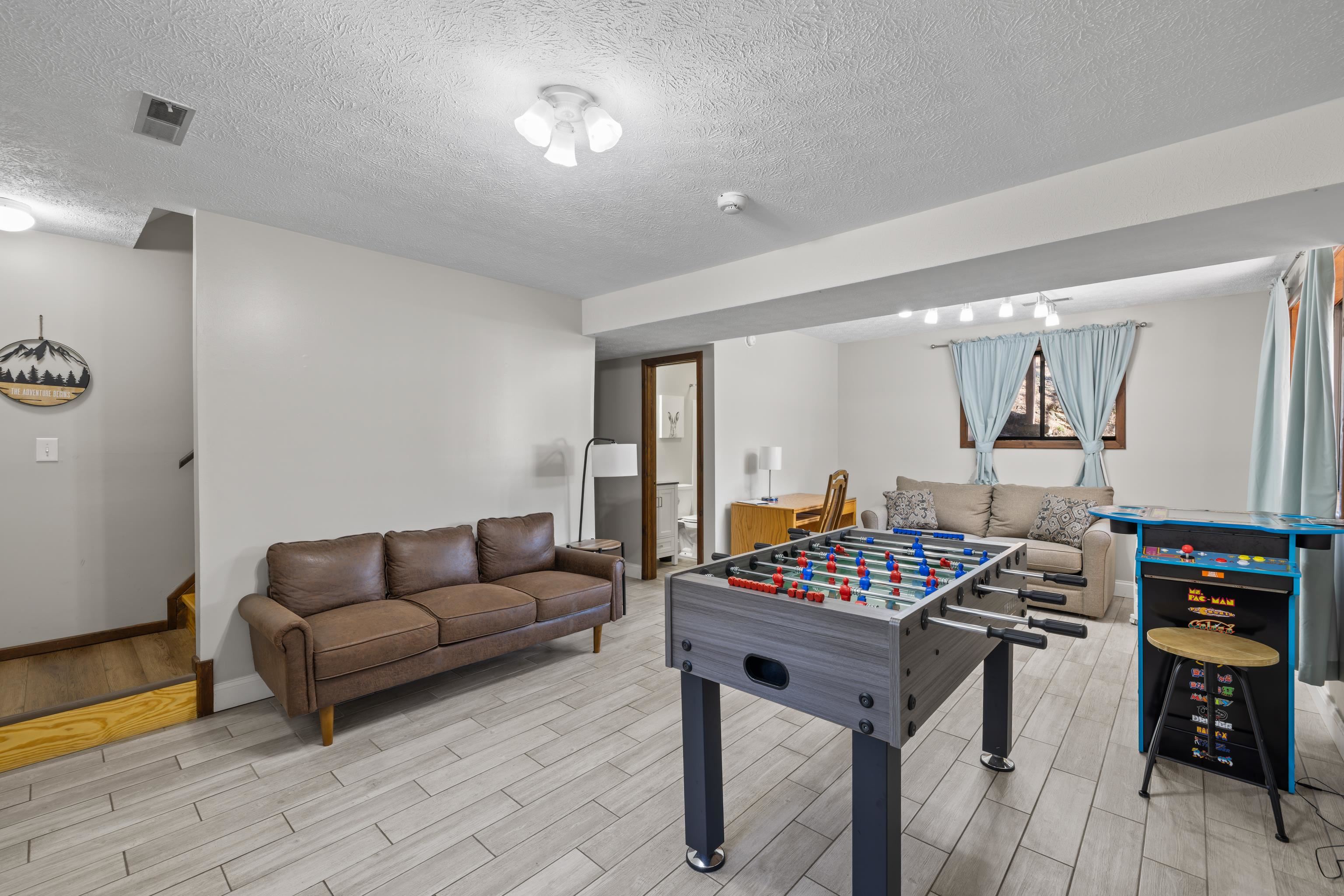 673 Killmon Road Basye, VA 22810 - Photo 36 of 74 a living room with furniture and a wooden floor