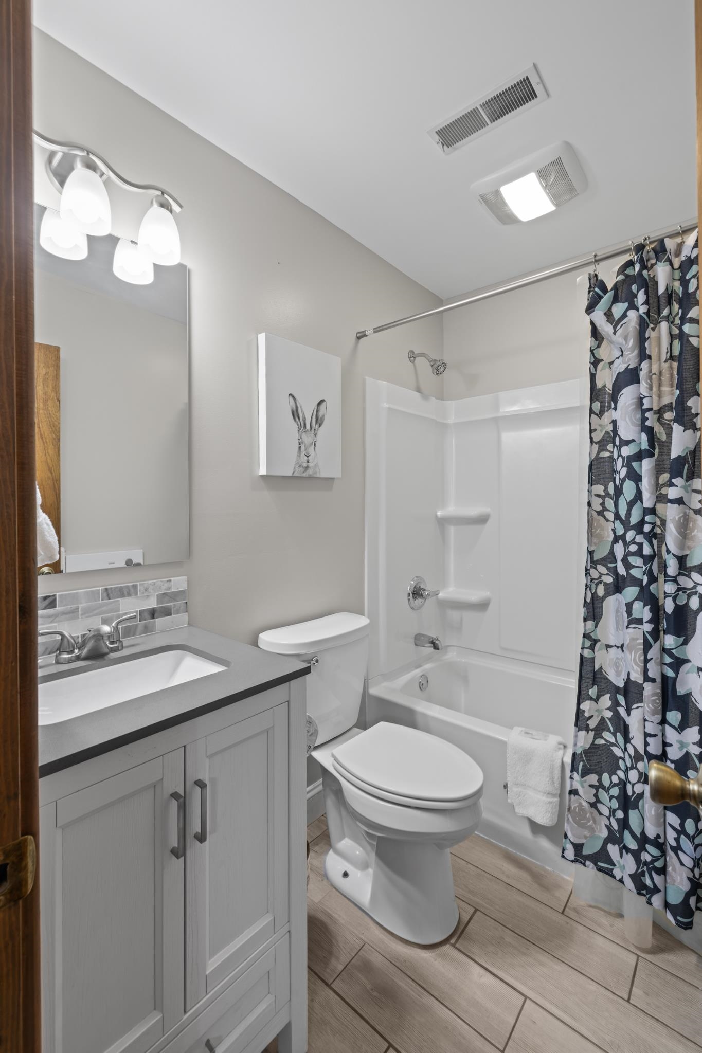 673 Killmon Road Basye, VA 22810 - Photo 45 of 74 a bathroom with a granite countertop toilet a sink a mirror a shower and vanity
