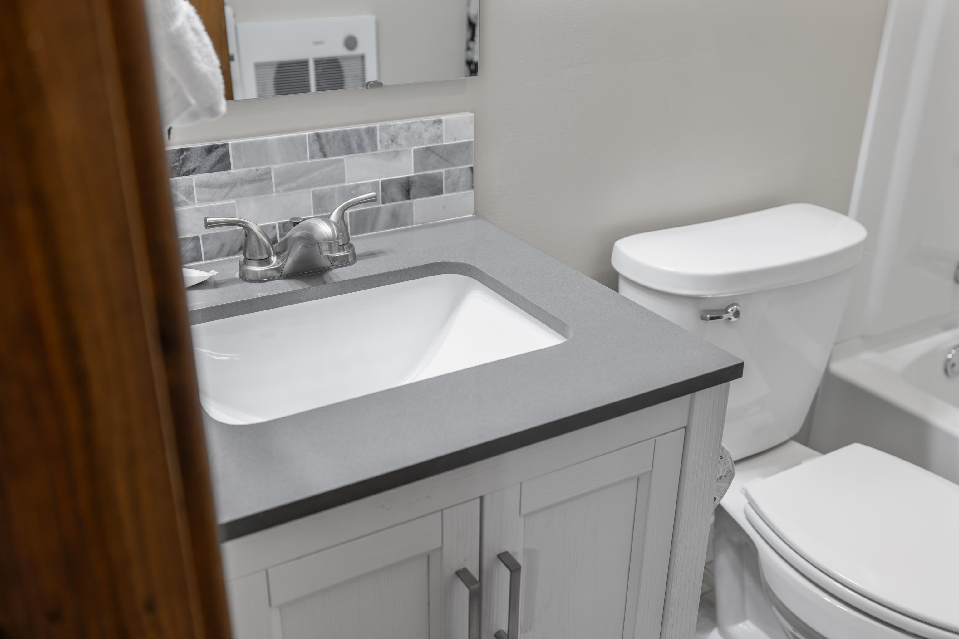 673 Killmon Road Basye, VA 22810 - Photo 46 of 74 a bathroom with a sink a toilet and shower